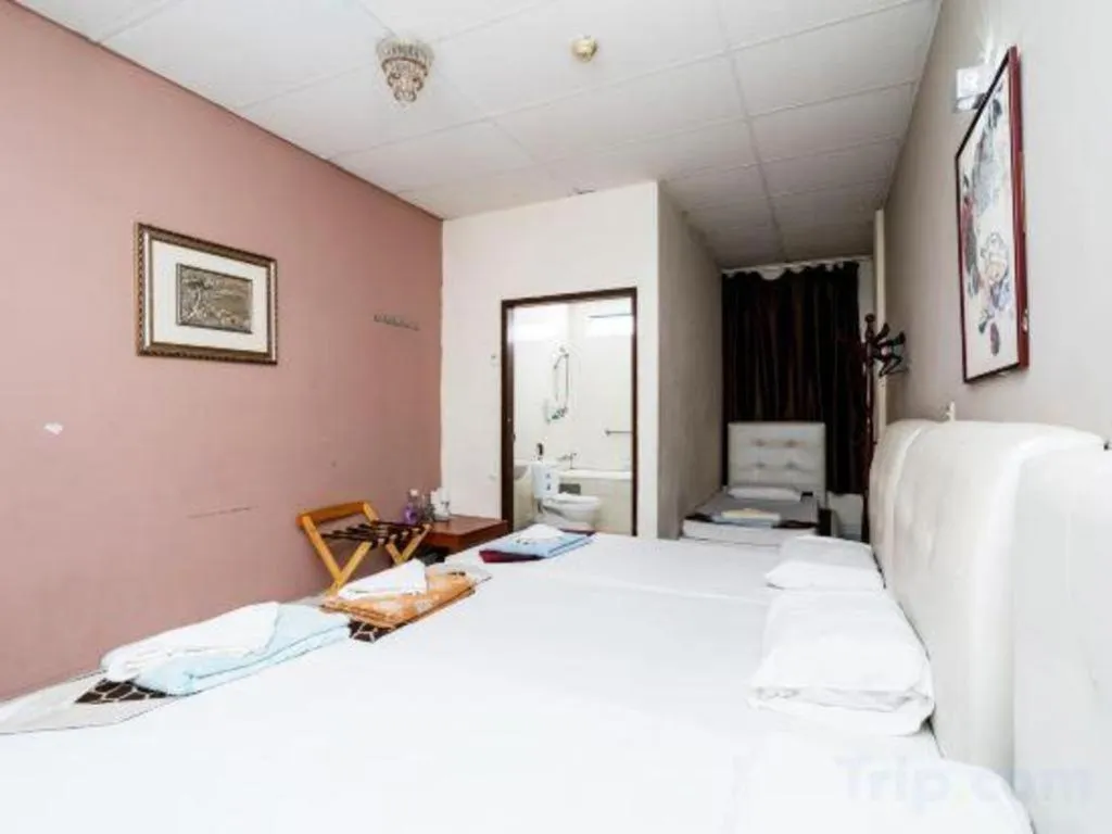 Bed in Lai Ming Hotel Cosmoland