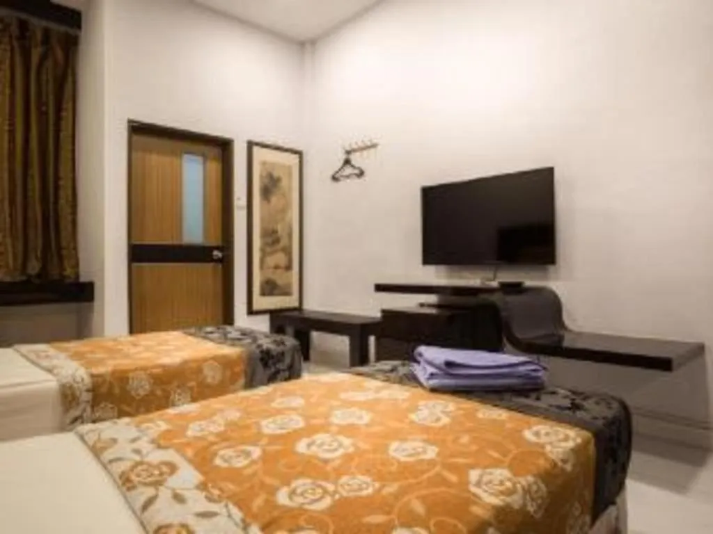 Bed in Lai Ming Hotel Cosmoland