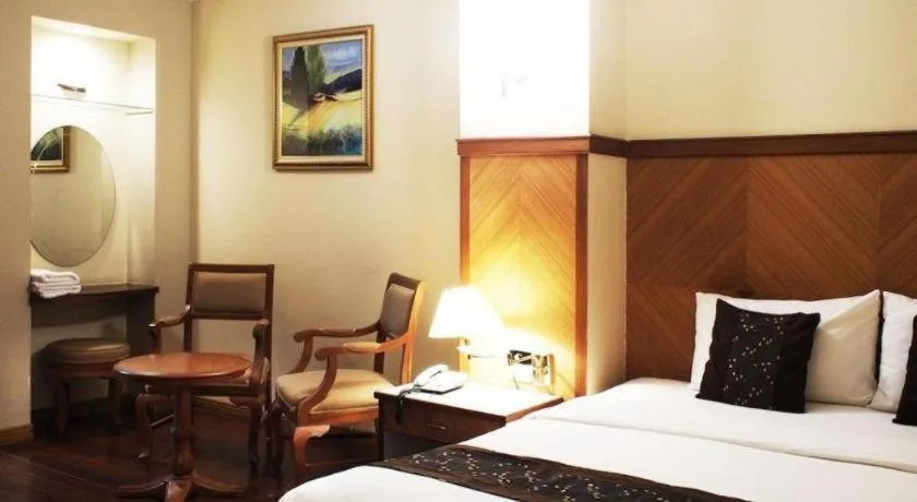 Bed in NH Elegant Hotel