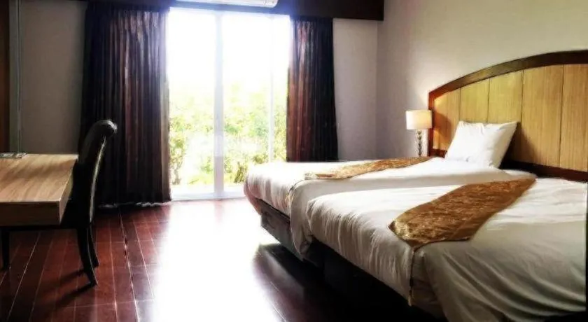 Bed in NH Elegant Hotel