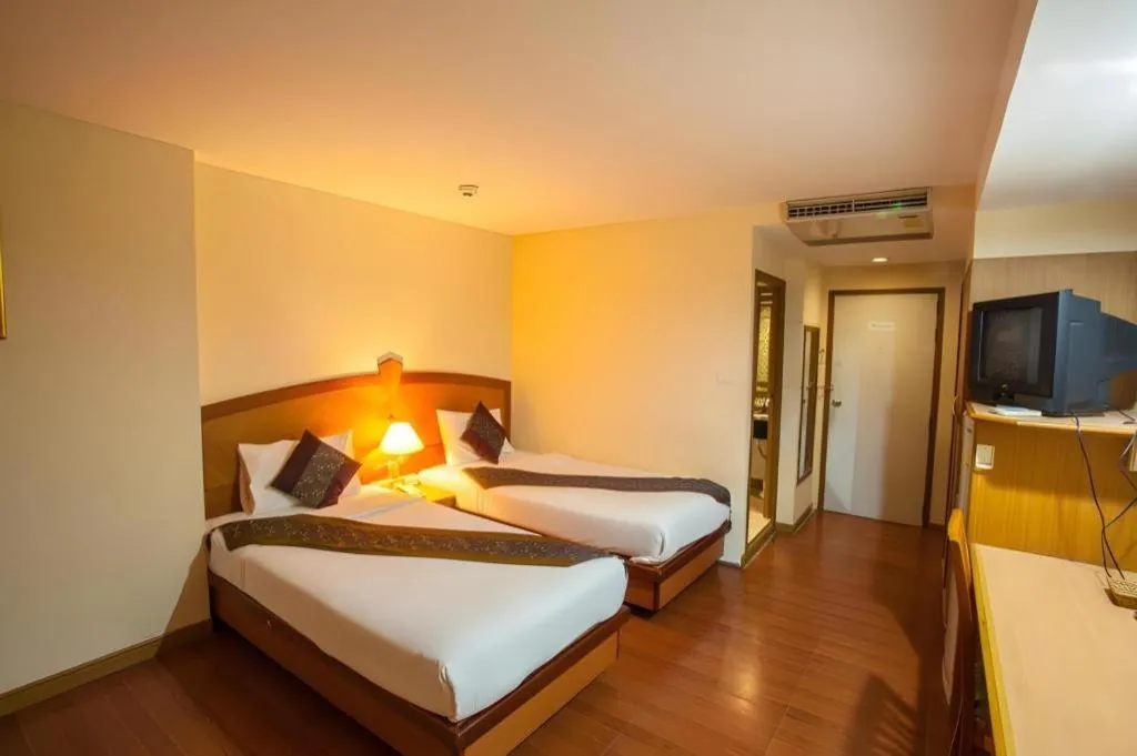 Bed in NH Elegant Hotel