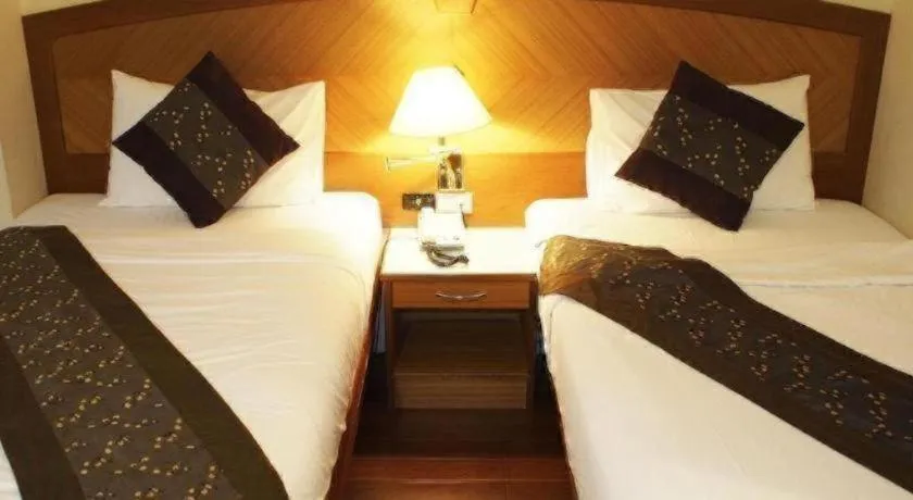 Bed in NH Elegant Hotel