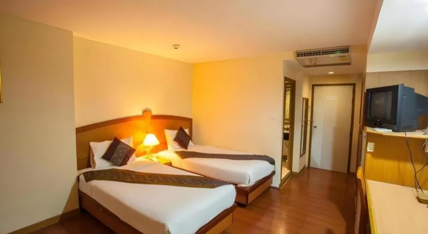 Bed in NH Elegant Hotel