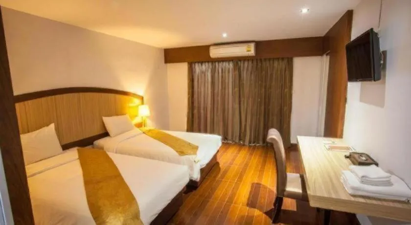 Bed in NH Elegant Hotel