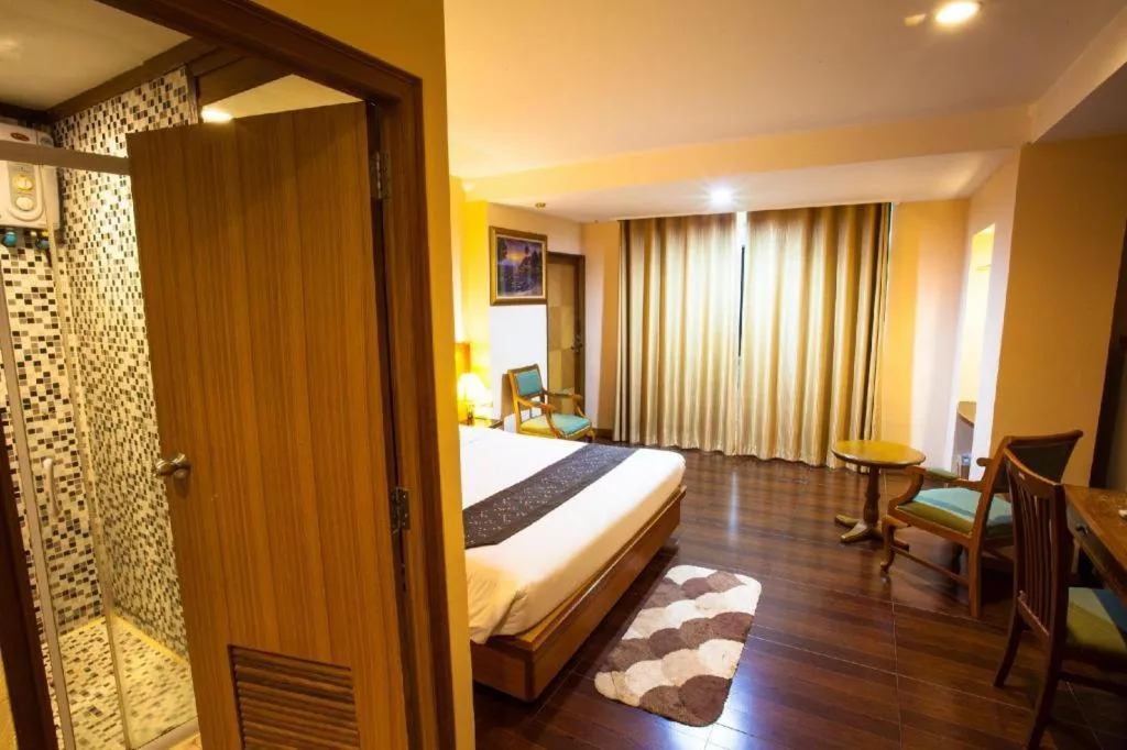 Bed in NH Elegant Hotel