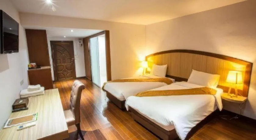 Bed in NH Elegant Hotel