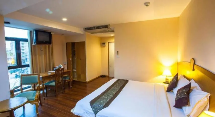 Bed in NH Elegant Hotel