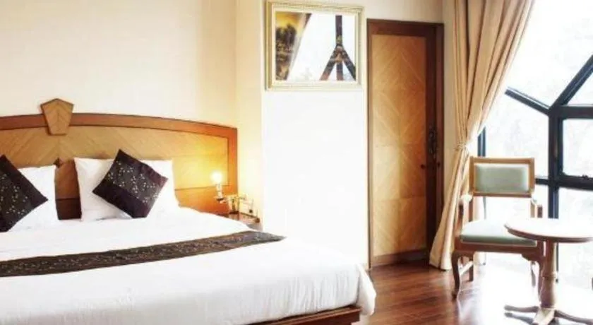 Bed in NH Elegant Hotel