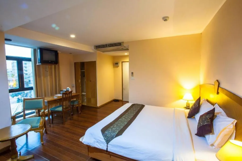 Bed in NH Elegant Hotel