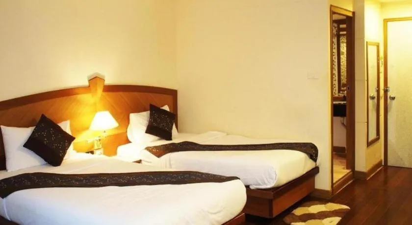 Bed in NH Elegant Hotel