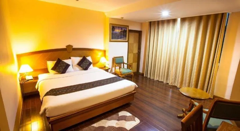 Bed in NH Elegant Hotel