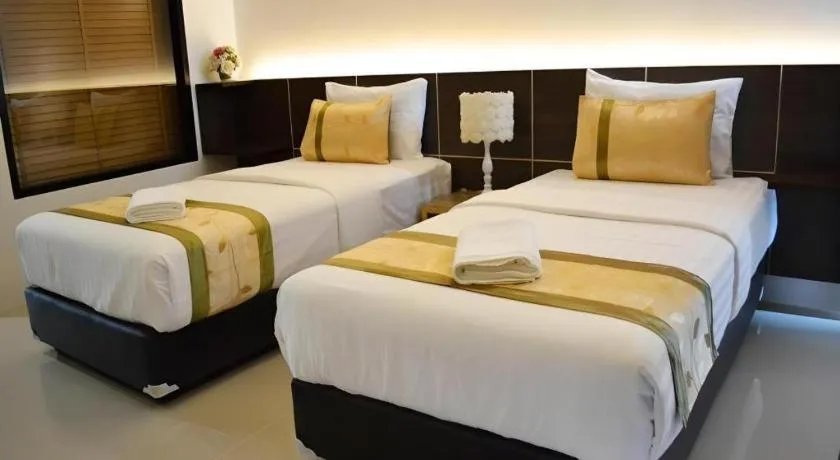 Bed in The Convenience Hotel