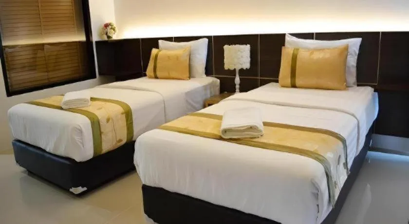 Bed in The Convenience Hotel