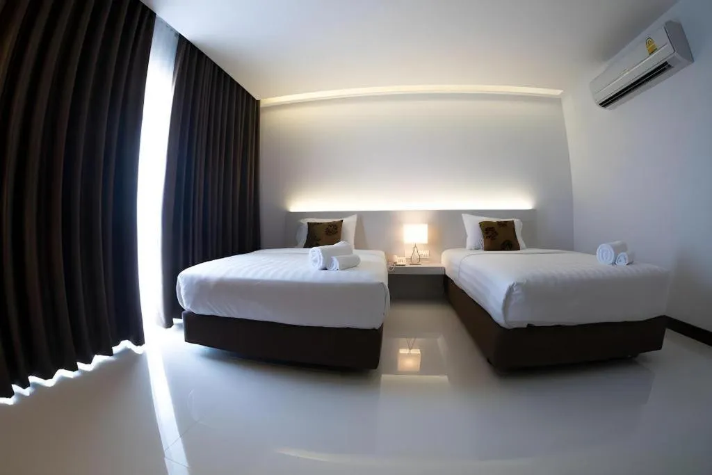 Bed in Chaisaeng Villa