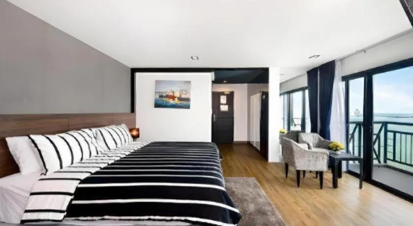 Bed in The Loft Seaside Sriracha Hotel