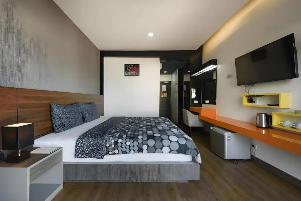 Bed in The Loft Seaside Sriracha Hotel