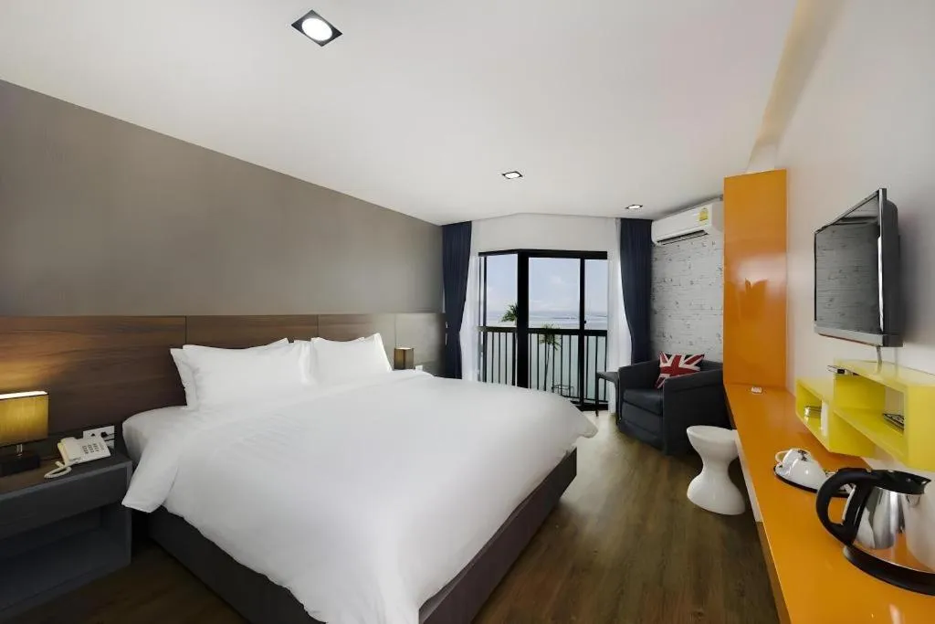 Bed in The Loft Seaside Sriracha Hotel