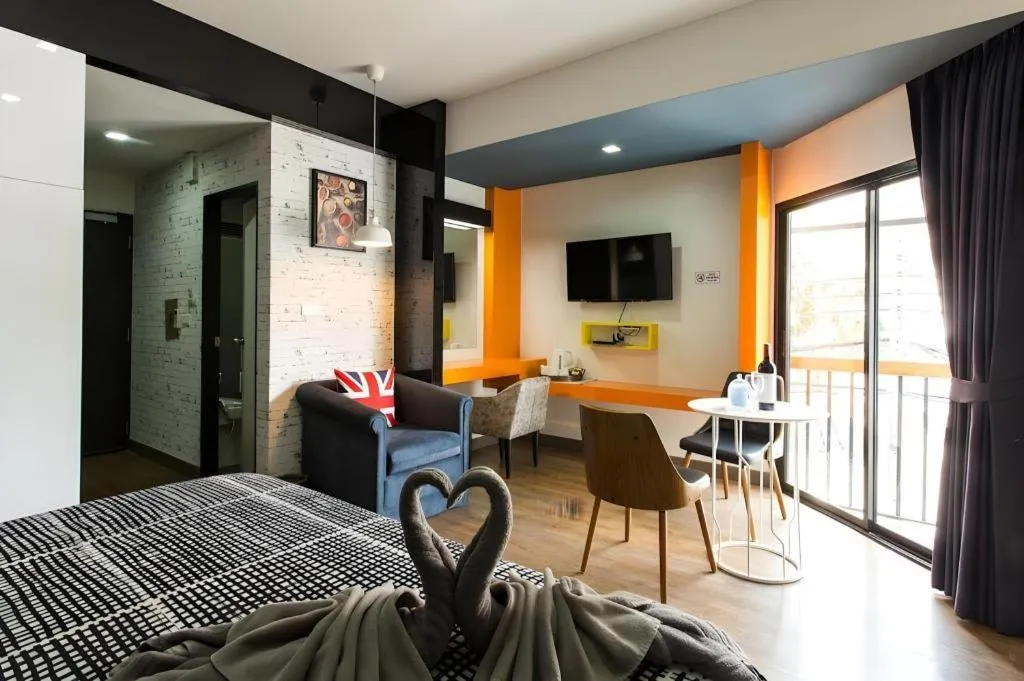 Bed in The Loft Seaside Sriracha Hotel