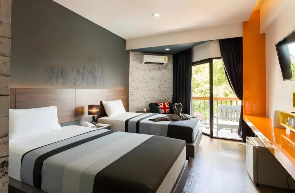 Bed in The Loft Seaside Sriracha Hotel