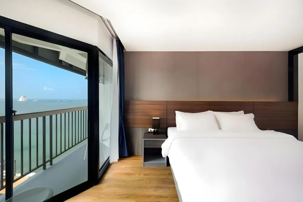 Bed in The Loft Seaside Sriracha Hotel