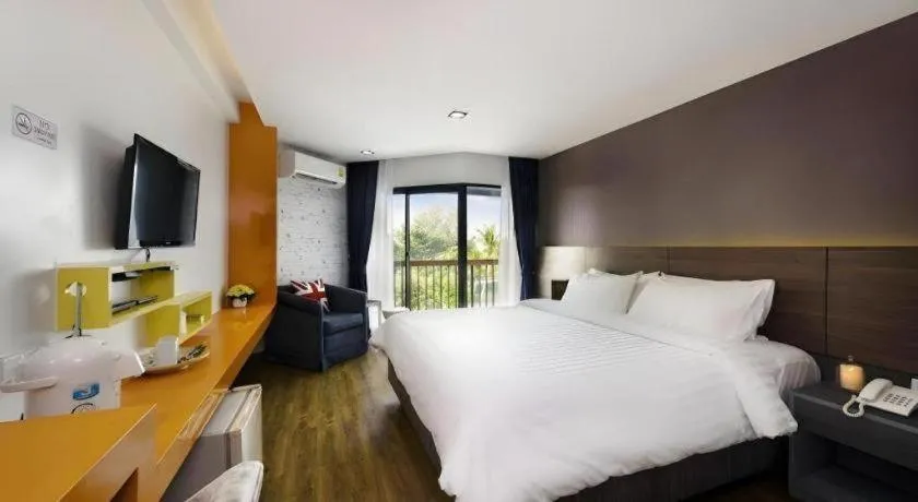 Bed in The Loft Seaside Sriracha Hotel