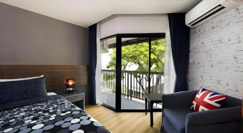 Bed in The Loft Seaside Sriracha Hotel