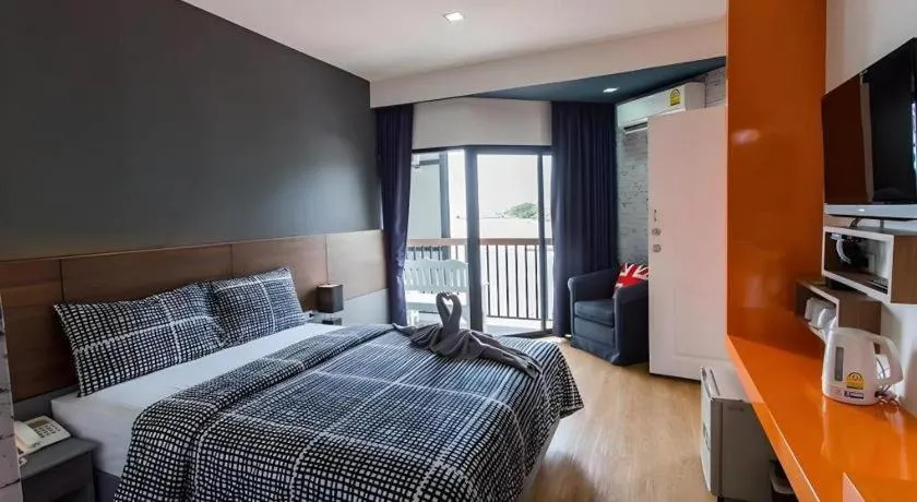 Bed in The Loft Seaside Sriracha Hotel