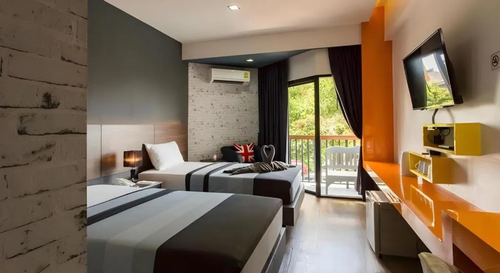 Bed in The Loft Seaside Sriracha Hotel