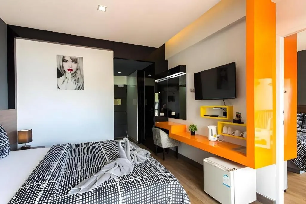 Bed in The Loft Seaside Sriracha Hotel