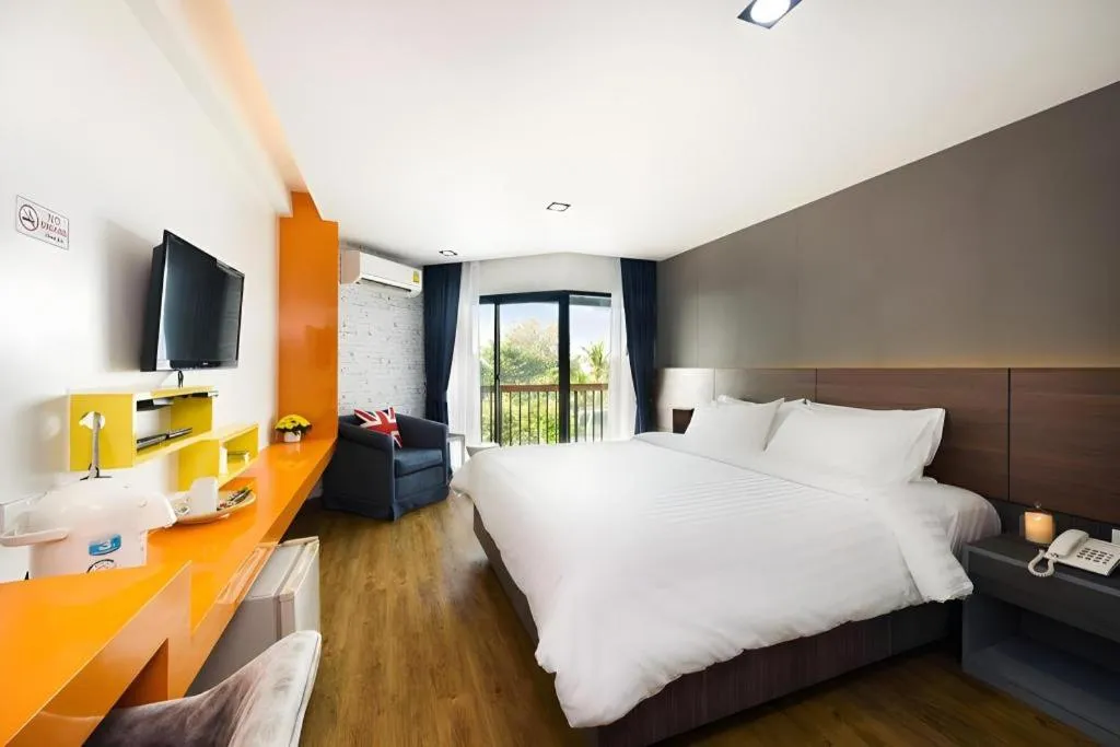 Bed in The Loft Seaside Sriracha Hotel