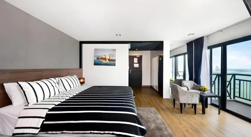 Bed in The Loft Seaside Sriracha Hotel