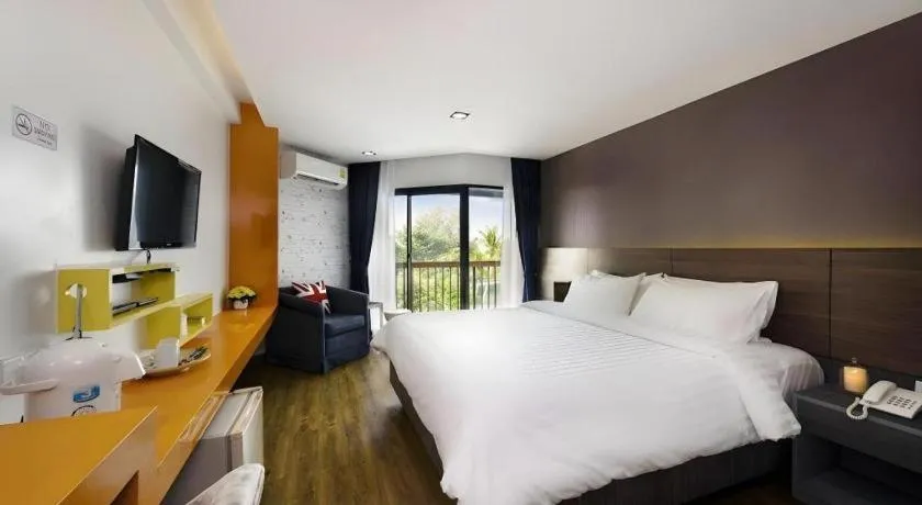 Bed in The Loft Seaside Sriracha Hotel