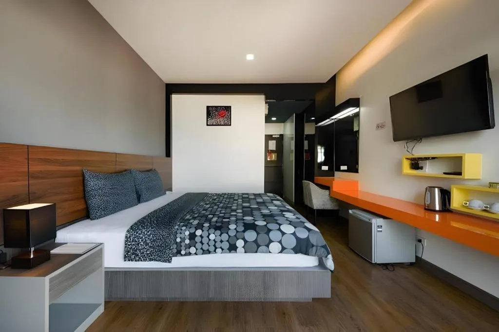 Bed in The Loft Seaside Sriracha Hotel