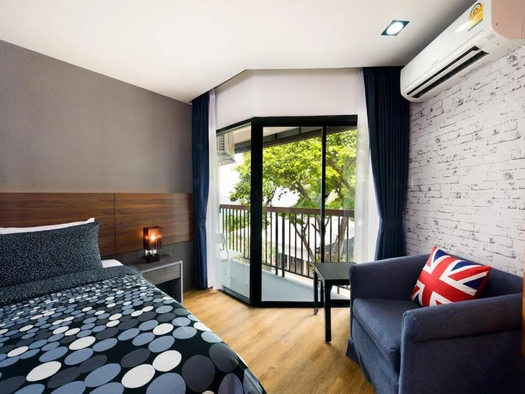 Bed in The Loft Seaside Sriracha Hotel