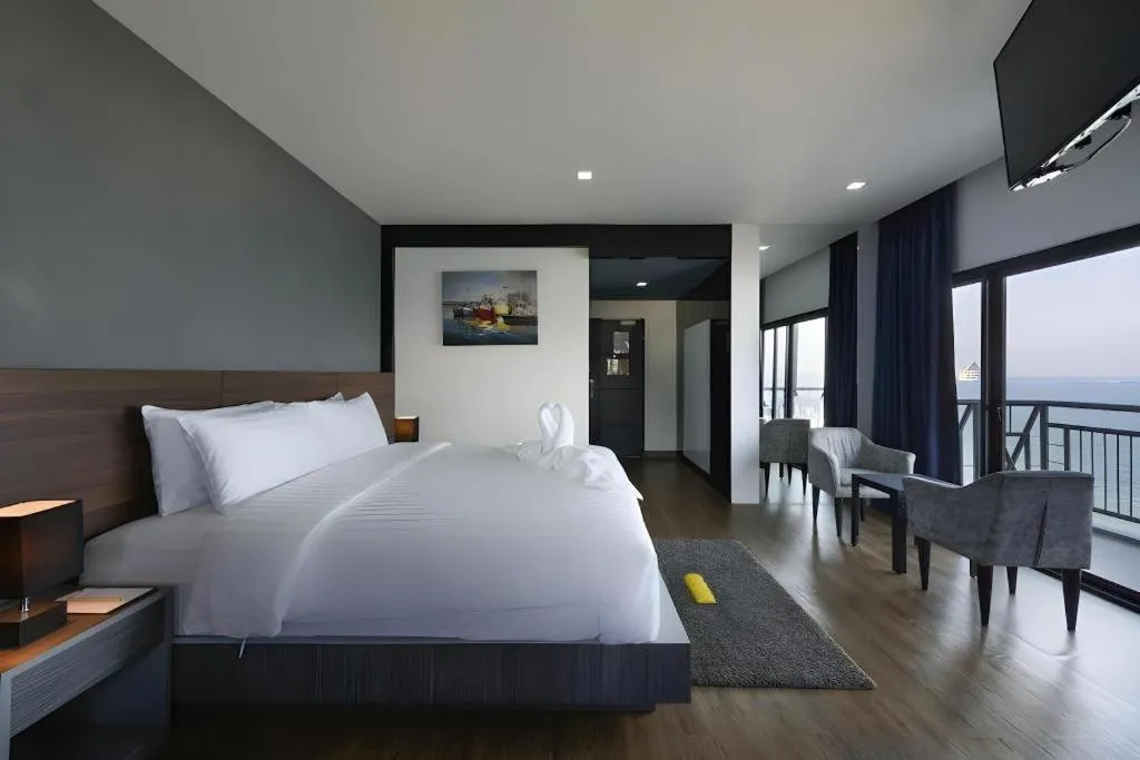 Bed in The Loft Seaside Sriracha Hotel