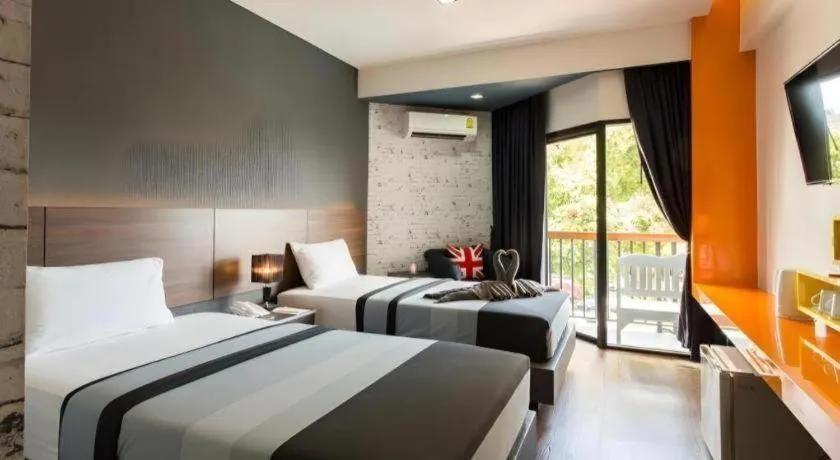 Bed in The Loft Seaside Sriracha Hotel