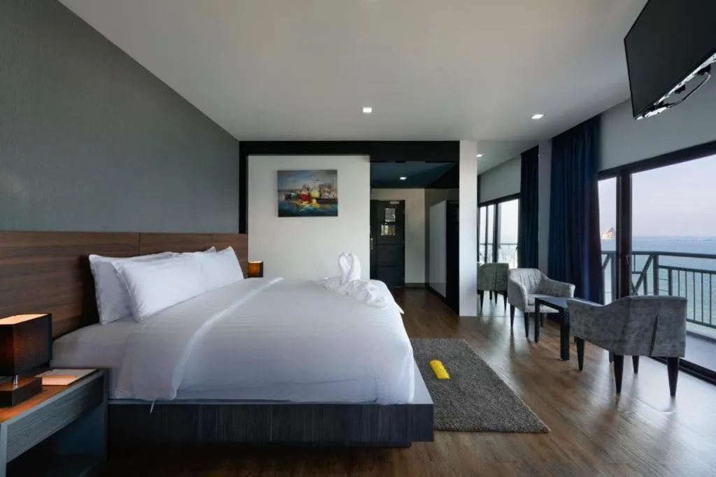 Bed in The Loft Seaside Sriracha Hotel