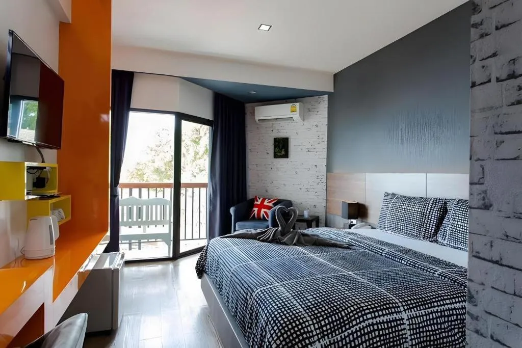 Bed in The Loft Seaside Sriracha Hotel