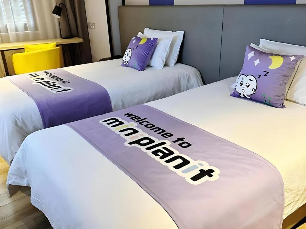 Bed in Magnotel Hotel Shanghai Jinjiang Park Branch