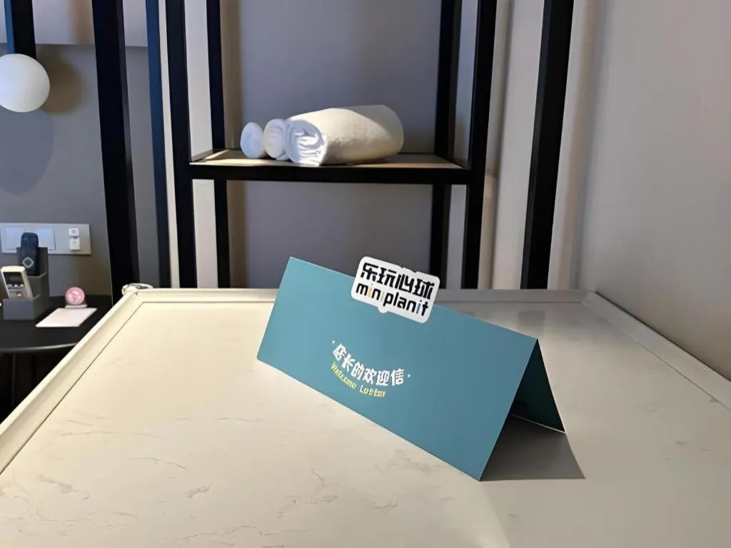 Bed in Magnotel Hotel Shanghai Jinjiang Park Branch