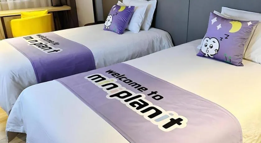 Bed in Magnotel Hotel Shanghai Jinjiang Park Branch