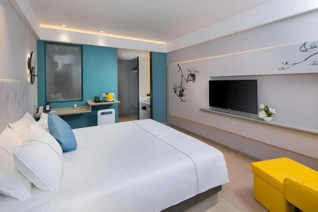 Bed in Magnotel Hotel Shanghai Jinjiang Park Branch