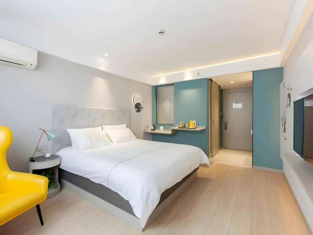 Bed in Magnotel Hotel Shanghai Jinjiang Park Branch