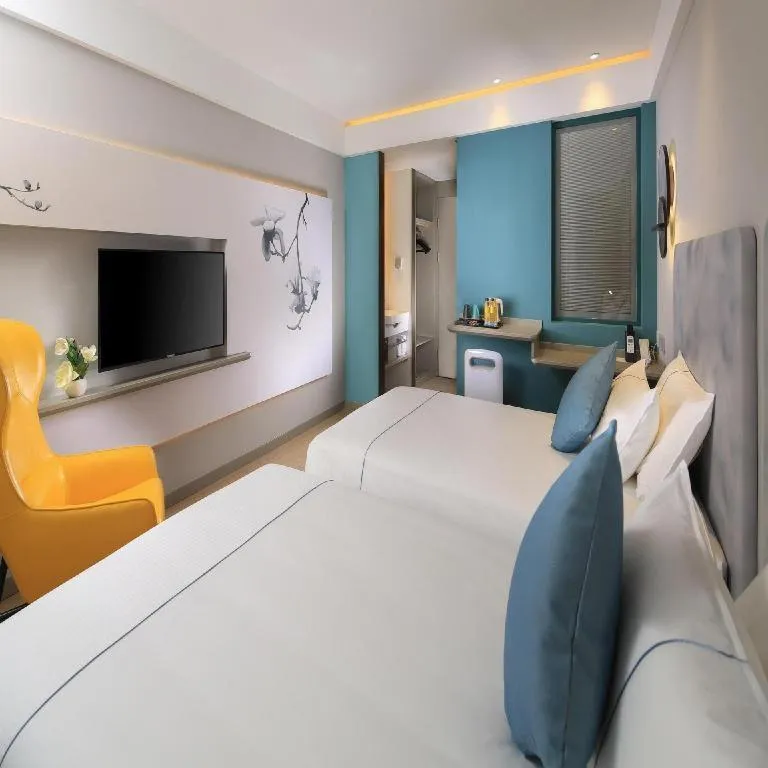 Bed in Magnotel Hotel Shanghai Jinjiang Park Branch