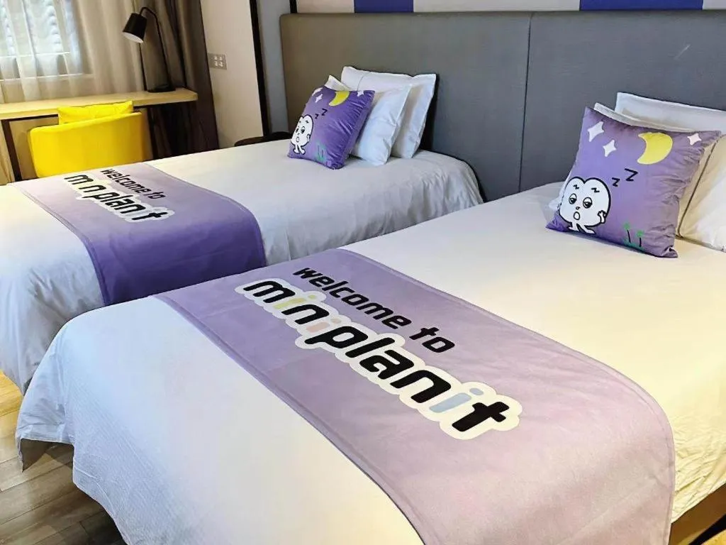 Bed in Magnotel Hotel Shanghai Jinjiang Park Branch