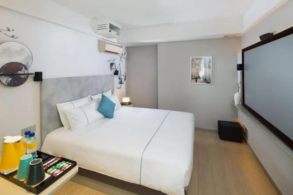 Bed in Magnotel Hotel Shanghai Jinjiang Park Branch