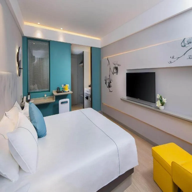 Bed in Magnotel Hotel Shanghai Jinjiang Park Branch