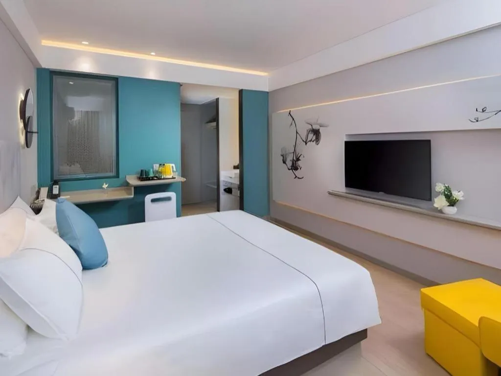 Bed in Magnotel Hotel Shanghai Jinjiang Park Branch