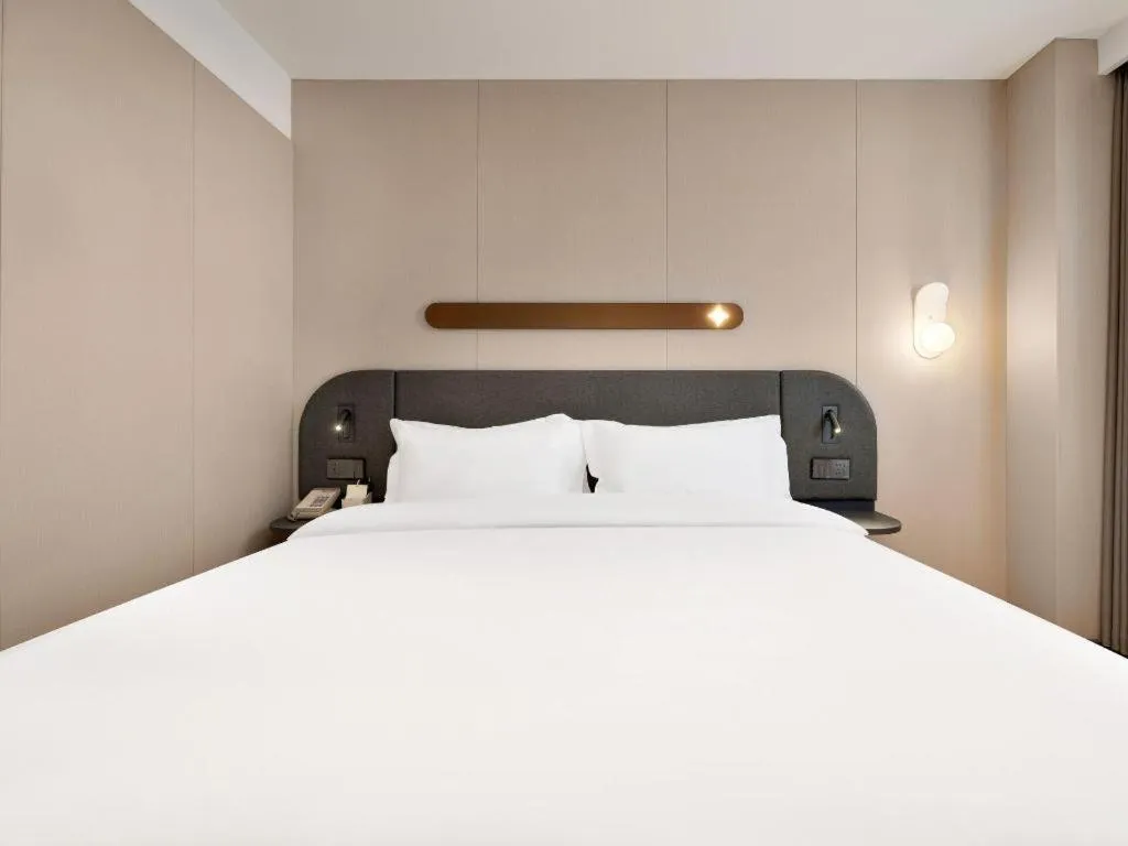 Bed in Jinjiang Inn Beijing Capital International Airport New Expo Metro Station