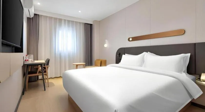 Bed in Jinjiang Inn Beijing Capital International Airport New Expo Metro Station